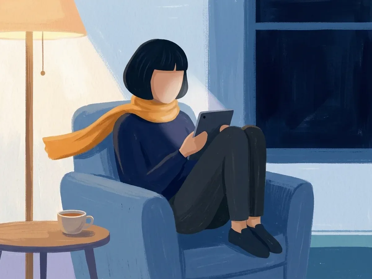 In the evening, the same person sits curled in a blue armchair, reading a tablet beside a lit floor lamp, a cup of tea, and a dark window.